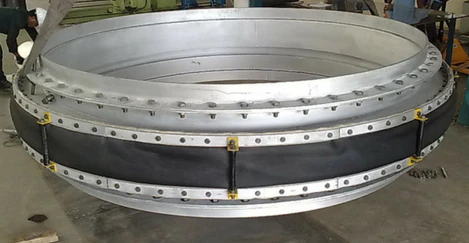 Large-diameter round fabric expansion joint with bolted flange frames